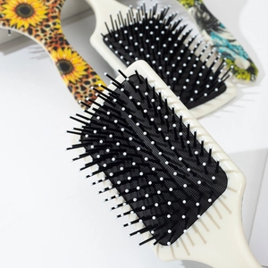 Vintage sunflower and leopard print paddle brushes with air cushion and massage bristles