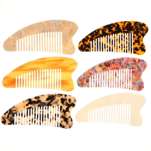 Set of 6 heart-shaped acetate hair combs in various colors like tortoiseshell and marble