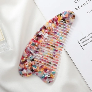 Floral acetate hair comb with marble texture on elegant white silk background