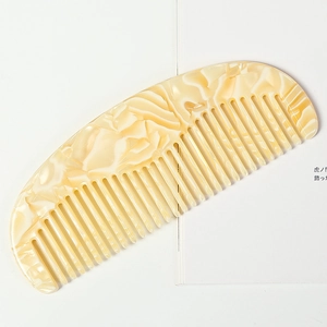 Acetate wide-tooth comb with elegant cream and yellow marble pattern for hair styling