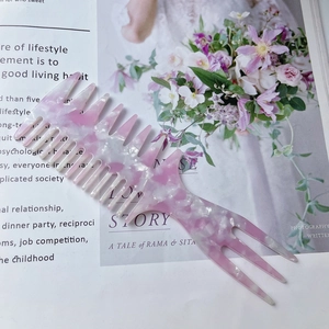 Pink marble acetate fishbone hair comb with wide teeth for styling wavy hair