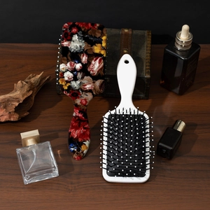 Vintage floral printed paddle hairbrush and white cushion brush for scalp massage