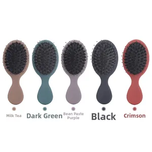 Five portable air cushion hair brushes in milky tea, dark green, mauve, black, and scarlet