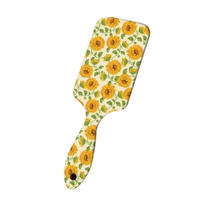 Sunflower print paddle air cushion hairbrush with ergonomic handle on white background