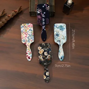 Set of 4 vintage floral air cushion paddle hairbrushes with scalp massage bristles