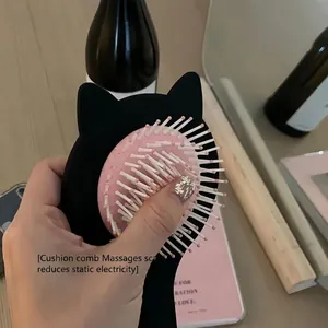 Cute black cat air cushion hairbrush with pink pad and massage bristles for scalp care