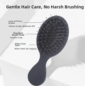 Detail of boar bristles and round nylon pins on a mini portable ergonomic hairbrush
