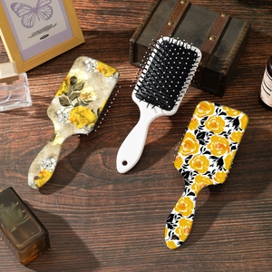Vintage yellow rose floral hair brushes set with anti-static air cushion on wood table