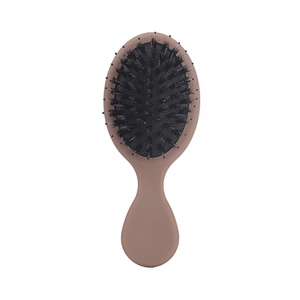 Mini portable boar bristle cushion hairbrush with ergonomic matte light brown handle