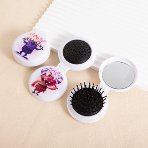 Portable folding hair brush with mirror and cute cartoon monster design for travel