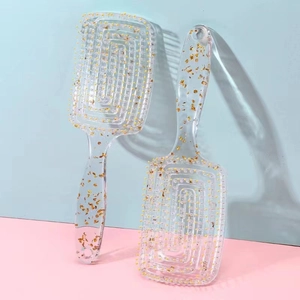 Luxe gold foil infusion hairbrushes with rounded tips for scalp massage and volume