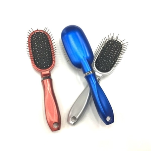 Portable metal pin air cushion massage hairbrushes in red, blue, and silver metallic finishes