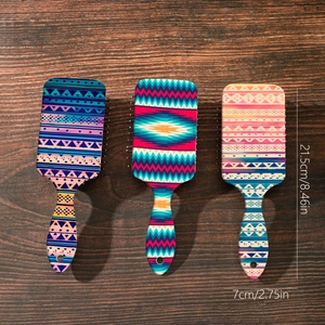 Set of three colorful Bohemian paddle hair brushes with scalp massage air cushions