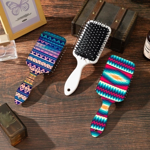 Bohemian pattern hair cushion brushes set for scalp massage on vintage wooden desk