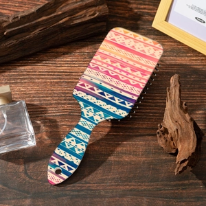 Close-up of bohemian pattern air cushion hair brush with colorful geometric print