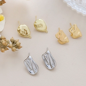 Macro detail of gold-plated baroque style earring findings for DIY jewelry making