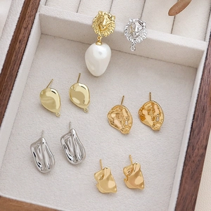 Baroque gold and silver earrings collection with irregular pearls and lion motifs