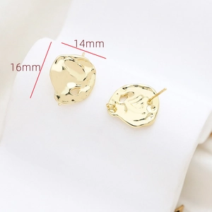 Detail view of 16mm x 14mm irregular golden baroque earrings with textured lava finish