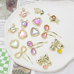 Assorted DIY aurora resin alloy charms with golden plating in heart and cherry shapes