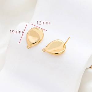 Macro detail of gold-plated teardrop earrings with dimensions showing 19mm length