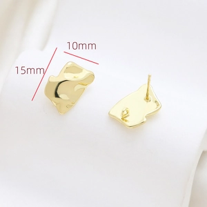 Detail of 15x10mm gold baroque earrings with organic lava texture and hanging loops