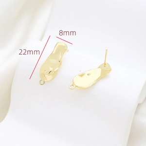 Macro shot of gold-plated baroque style DIY earring studs with 22mm by 8mm size dimensions