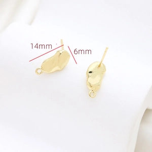 Detail of 14mm x 6mm gold-plated baroque earrings with lava texture and DIY hanging loop