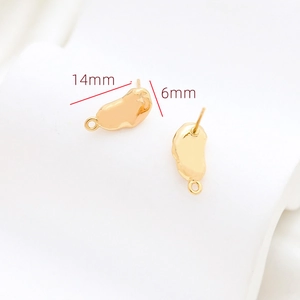 Detailed macro view of gold baroque irregular molten studs with hanging loops, 14mm size