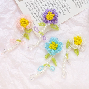 Handmade woven bead flower pendants in pink, blue, purple, and white colors