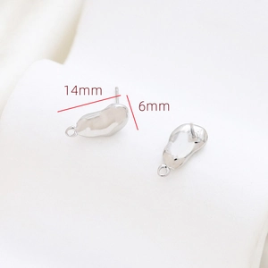 Detailed size view of silver irregular stud earrings with 925 hallmarks, 14mm by 6mm