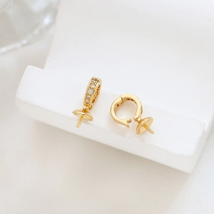 Macro view of 18K gold plated DIY earring settings with clear zircon and pin tray
