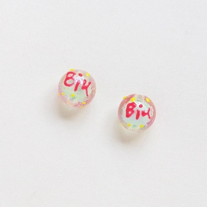 Macro detail of tulip hand-painted beads with Biu lettering for DIY jewelry crafting