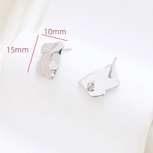 Macro shot of minimalist silver baroque style stud earrings with size marking 15mm by 10mm