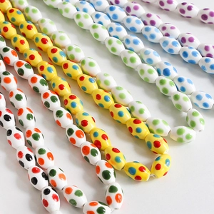 Oval dotted ceramic beads for DIY jewelry making in vibrant colorful patterns