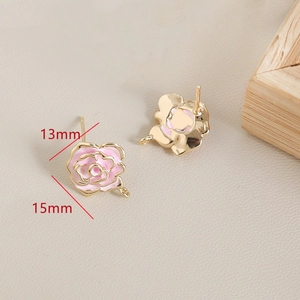 Detail view of 15mm pink camellia earrings with measurements and golden flower frame