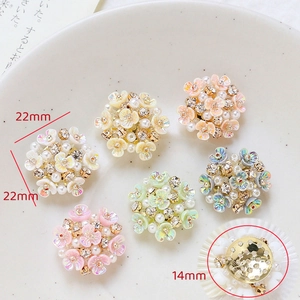 Detail of 22mm colorful resin flower charms with pearls and rhinestones for DIY crafts