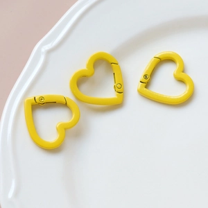 Three yellow heart-shaped metal spring clasps for DIY jewelry and keychain crafts