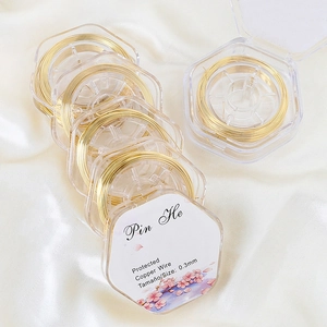 0.3mm gold plated copper wire on spools for DIY jewelry making on white silk