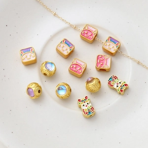 Macro detail of Chinese style gold plated rabbit and fortune beads for DIY jewelry making