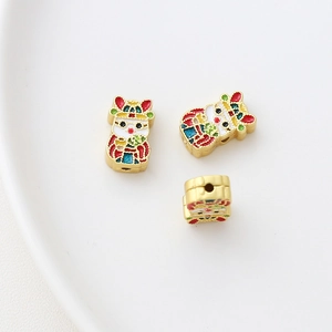 Detail of gold-plated rabbit beads with colorful enamel for DIY jewelry making