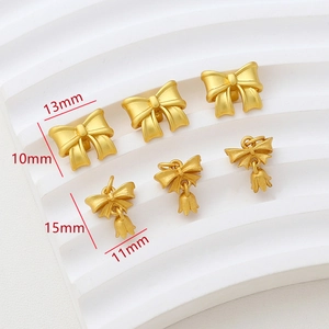 Gold-plated bow pendants for jewelry making with detailed size measurements and matte finish