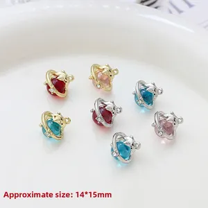Macro shot of 14x15mm colorful planet bear charms for DIY jewelry making in a white bowl