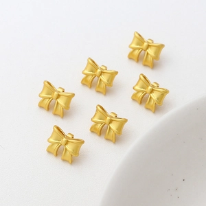 Matte gold bow-shaped metal jewelry pendants for DIY necklace and bracelet crafting