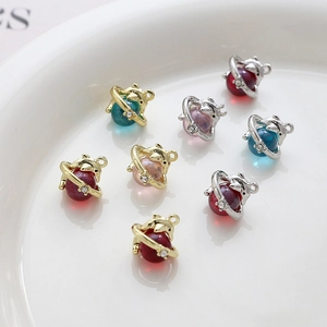Detailed view of bear-shaped planet charms for DIY jewelry making in multiple colors