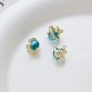Three gold alloy dolphin charms with blue beads for DIY jewelry making and crafts
