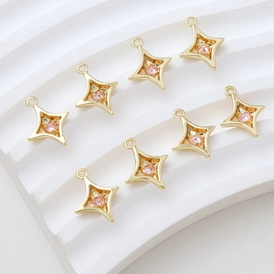 Set of eight 14k gold plated star pendants with pink heart-shaped cubic zirconia stones