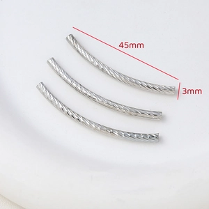 Detailed view of silver 45mm threaded curved tube spacers for DIY jewelry making