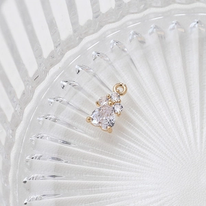 Detailed macro view of heart-shaped gold plated zircon charm for DIY jewelry making