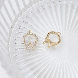 Detailed macro view of gold-plated zircon heart star bow pendant with honeycomb backing