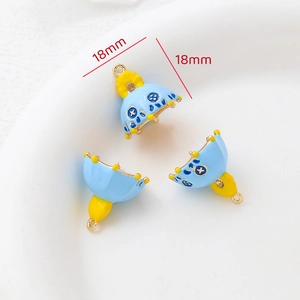 Macro view of blue and yellow enameled bell-shaped charms with 18mm size scale